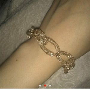Gold plated bracelet with diamonds inside